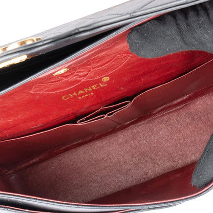 Chanel Quilted Lambskin 24K Gold Medium Double Flap Crossbody Bag